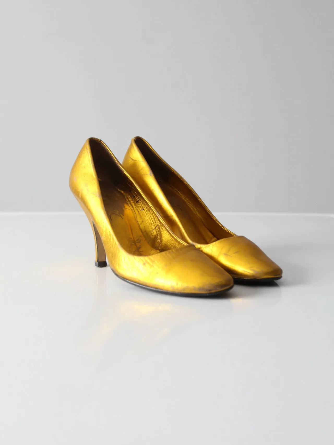 vintage gold metallic pumps